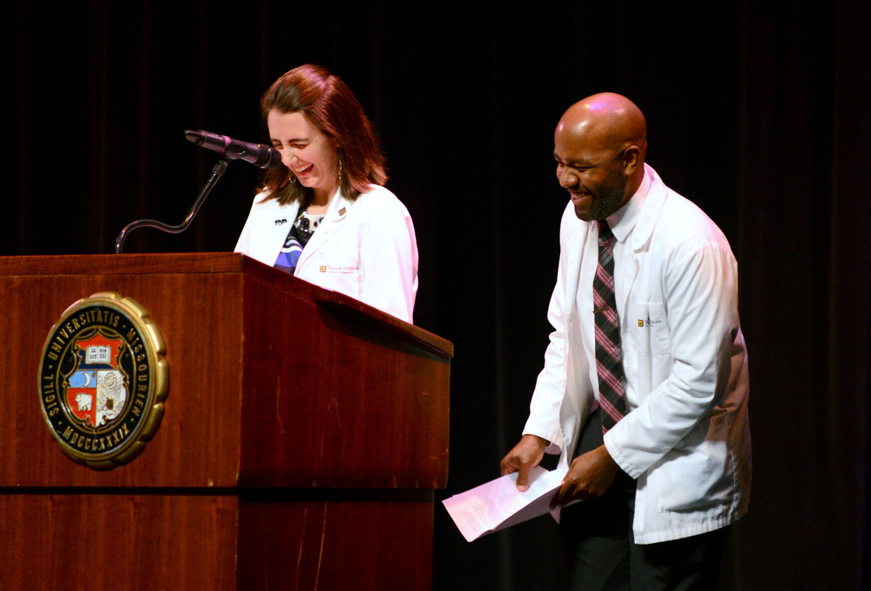 Samantha Unangst and Taylor Brooks address new students